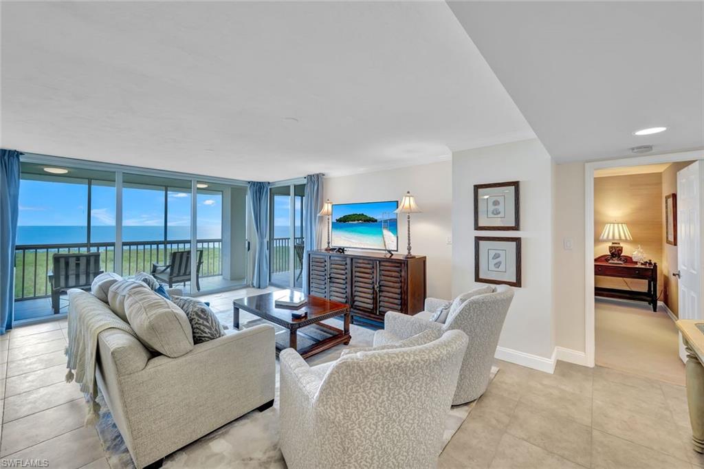 6573 Marissa Loop, Unit 2003 Naples, FL 34108 - Photo 4 of 41 a living room with furniture and a window