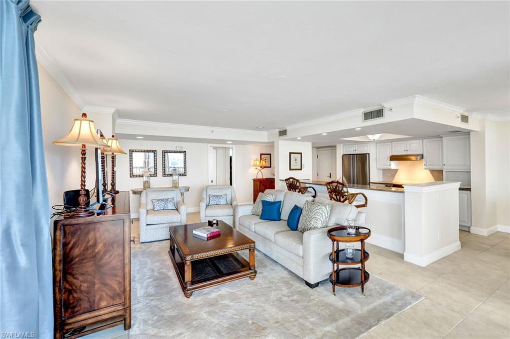 6573 Marissa Loop, Unit 2003 Naples, FL 34108 - Photo 6 of 41 a living room with furniture and a table