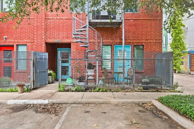 a front view of a building and a yard