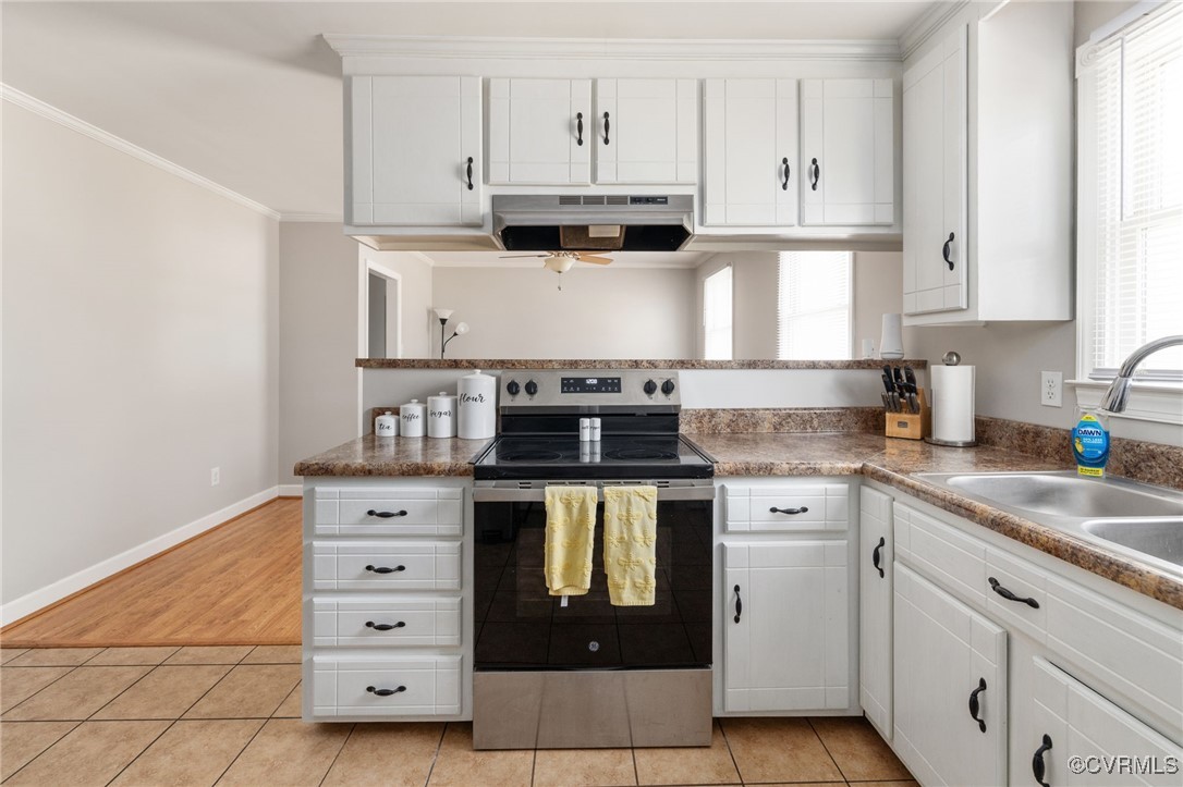 3901 Grovewood Road Hopewell, VA 23860 - Photo 21 of 42 a kitchen with stainless steel appliances granite countertop a stove and a white cabinets