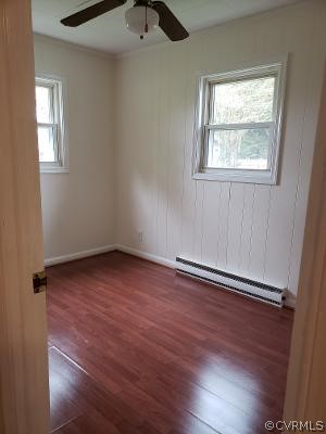 197 Hampton Road Dunnsville, VA 22454 - Photo 8 of 20 Bedroom 2 with laminate flooring and ceiling fan