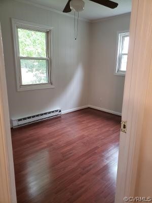 197 Hampton Road Dunnsville, VA 22454 - Photo 9 of 20 Bedroom 1 with laminate flooring and ceiling fan