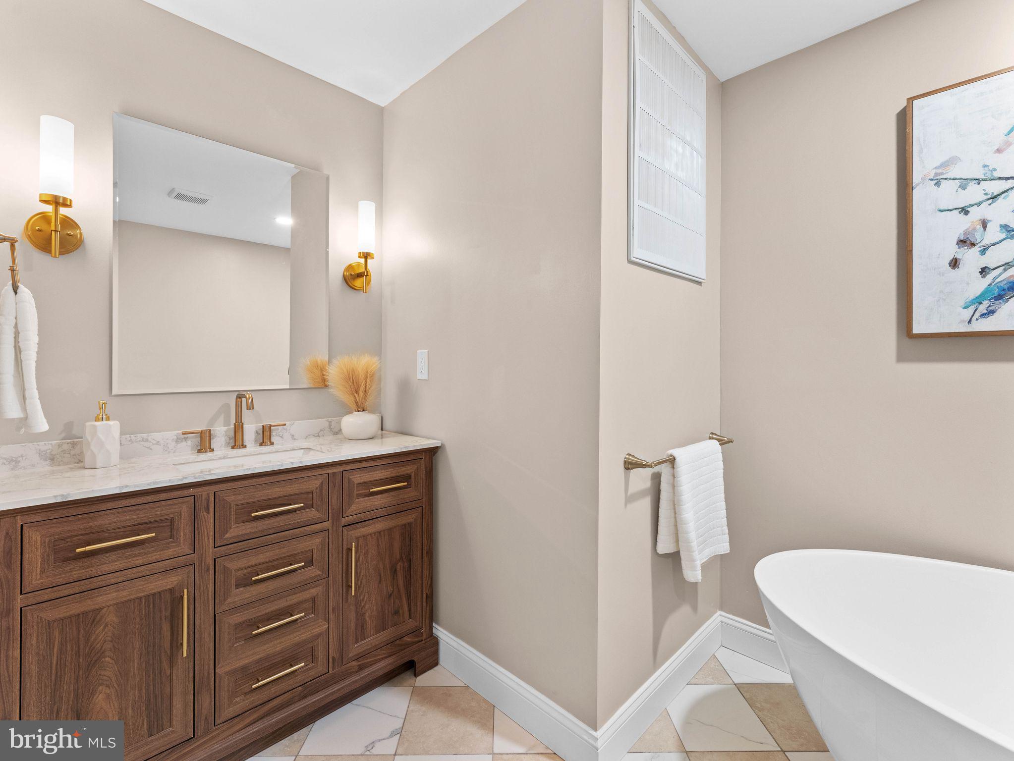 800 Bentley Road Lindenwold, NJ 08021 - Photo 16 of 32 a spacious bathroom with a granite countertop sink and a mirror