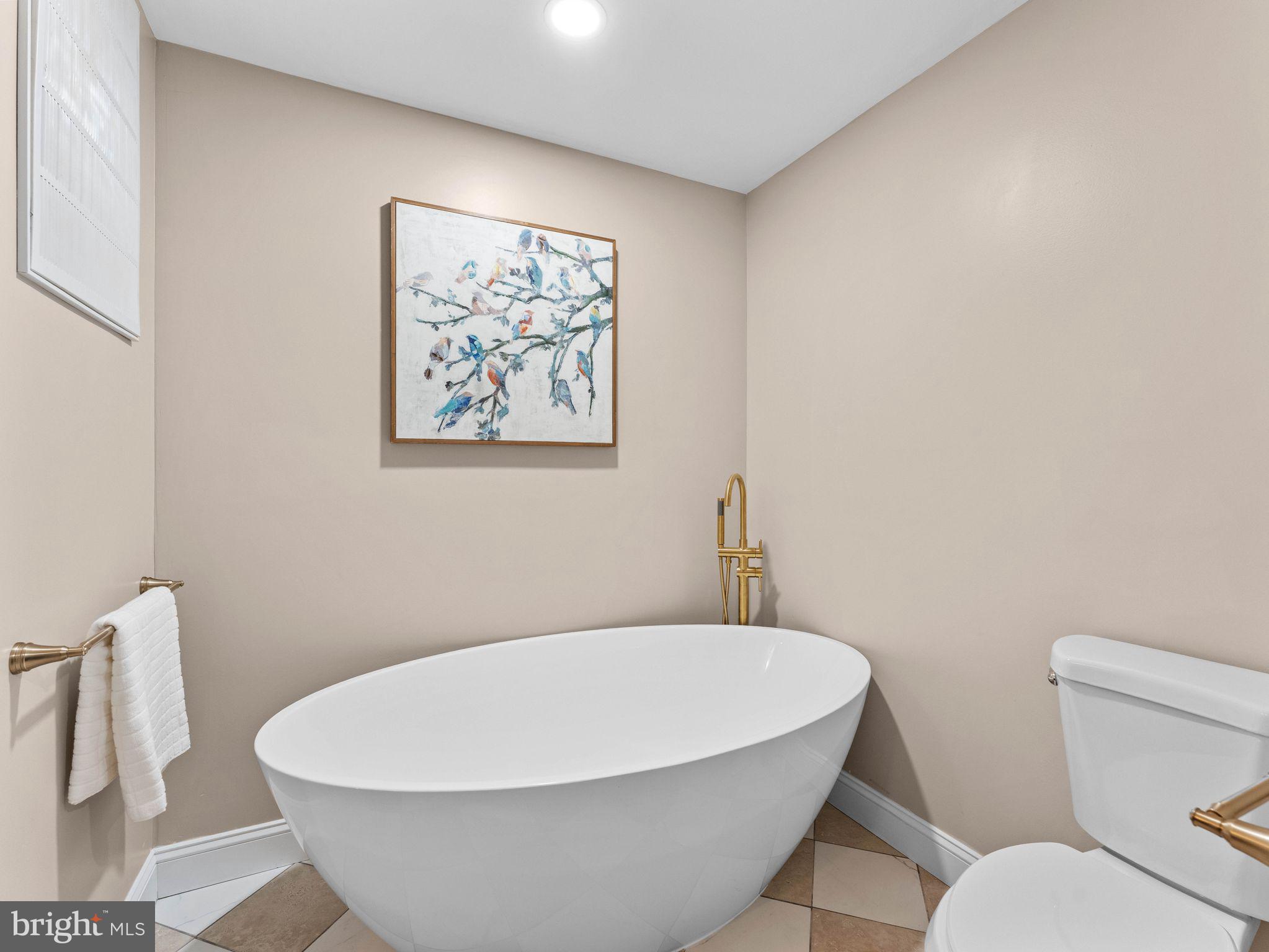 800 Bentley Road Lindenwold, NJ 08021 - Photo 17 of 32 a white bath tub sitting in a bathroom