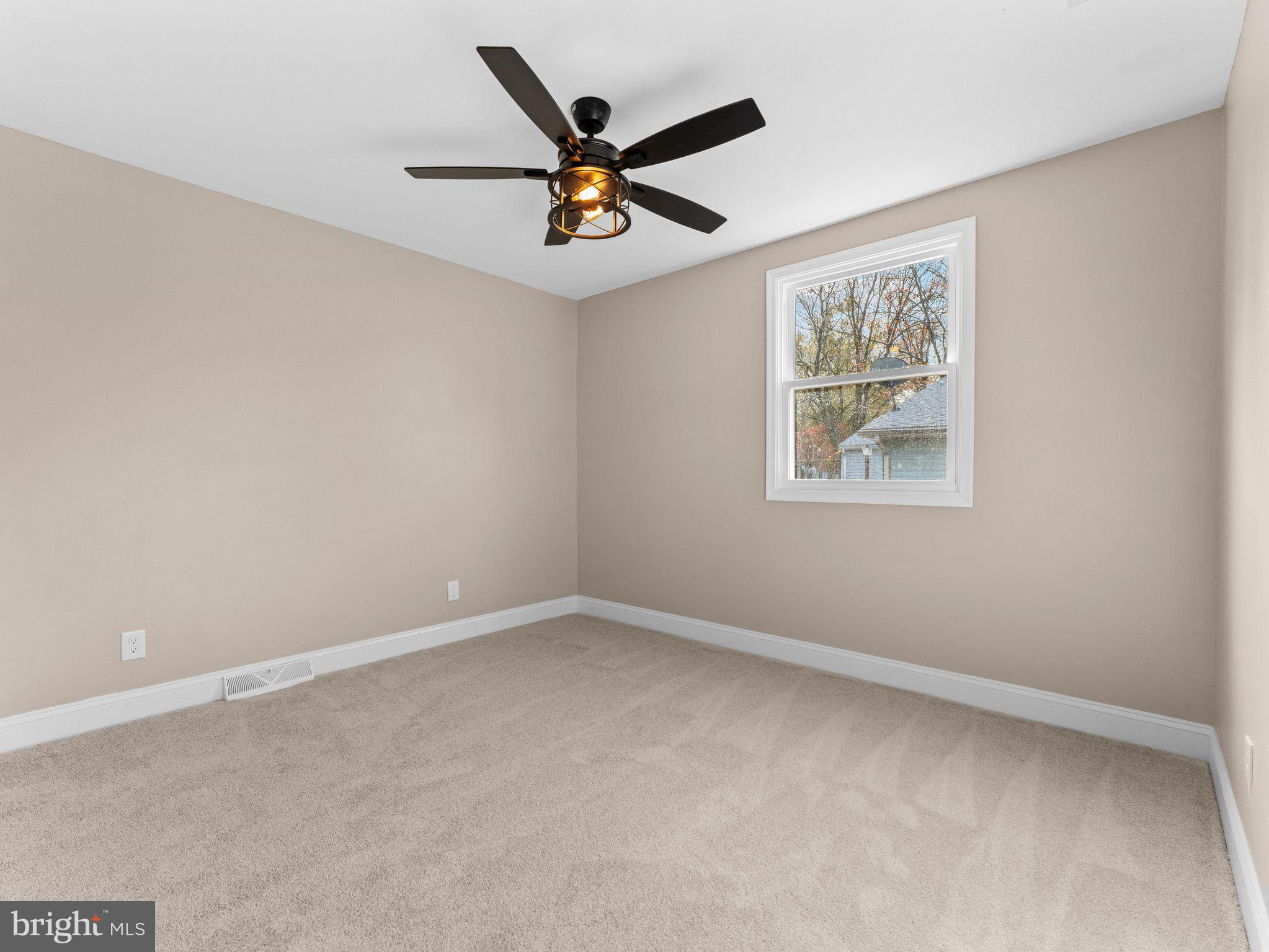 800 Bentley Road Lindenwold, NJ 08021 - Photo 19 of 32 an empty room with ceiling fan and windows