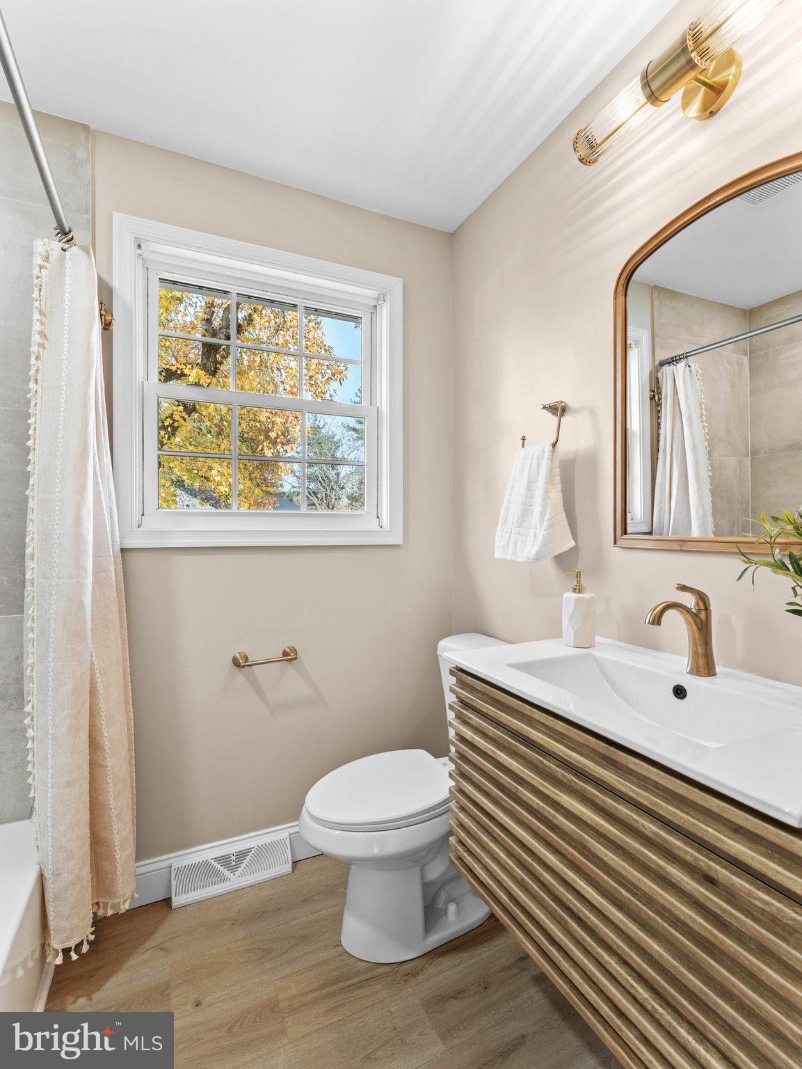 800 Bentley Road Lindenwold, NJ 08021 - Photo 24 of 32 a bathroom with a toilet a sink and a mirror