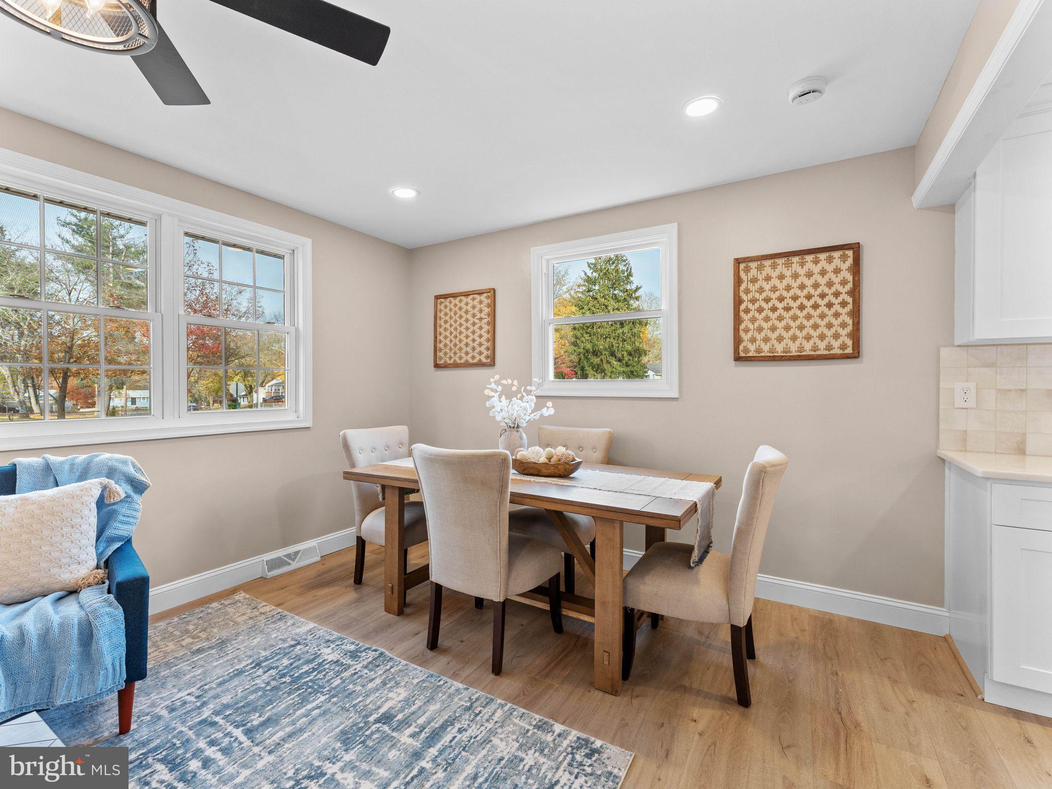 800 Bentley Road Lindenwold, NJ 08021 - Photo 5 of 32 a view of a dining room with furniture a rug and wooden floor