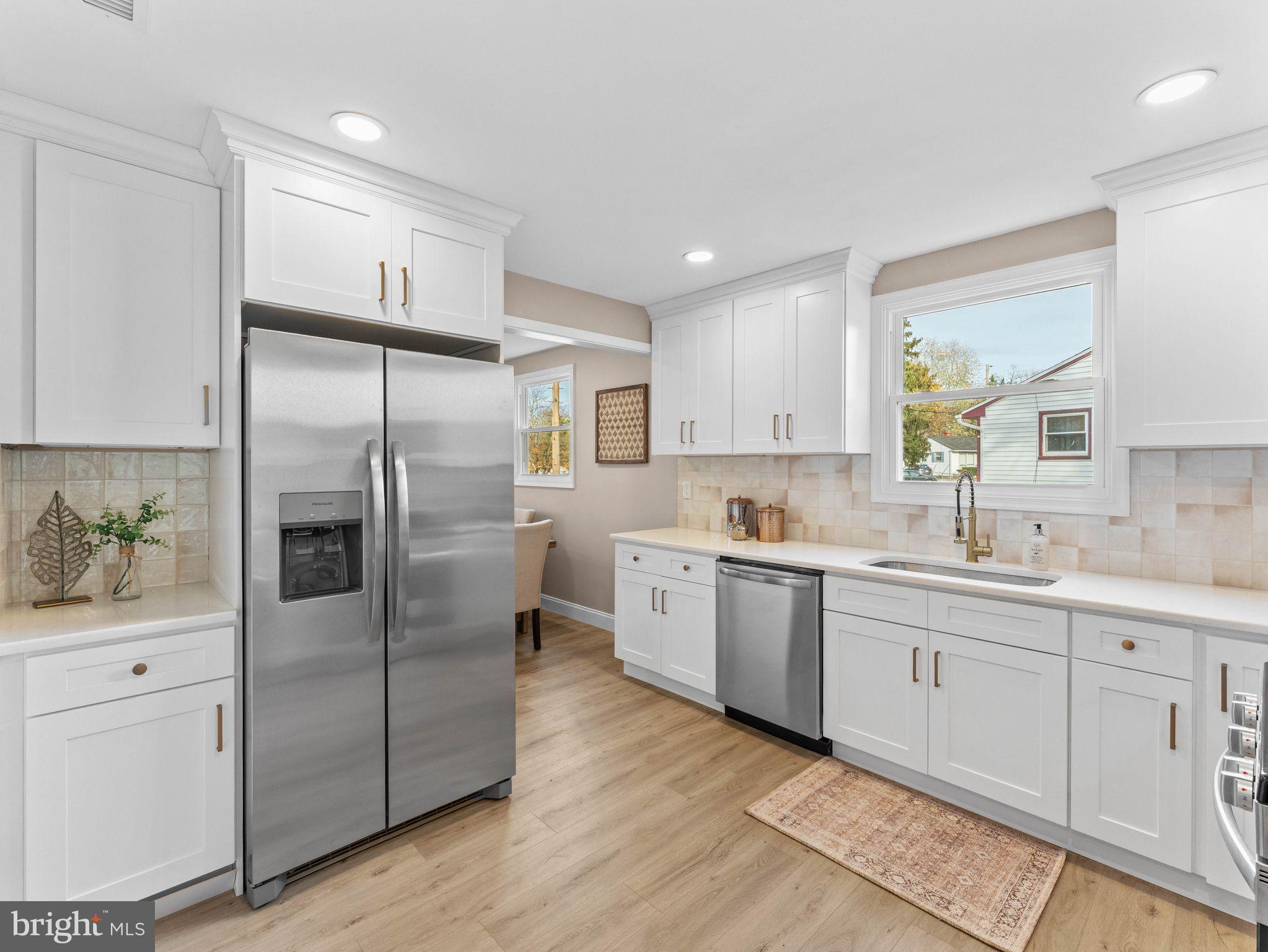 800 Bentley Road Lindenwold, NJ 08021 - Photo 8 of 32 a kitchen with white cabinets and stainless steel appliances