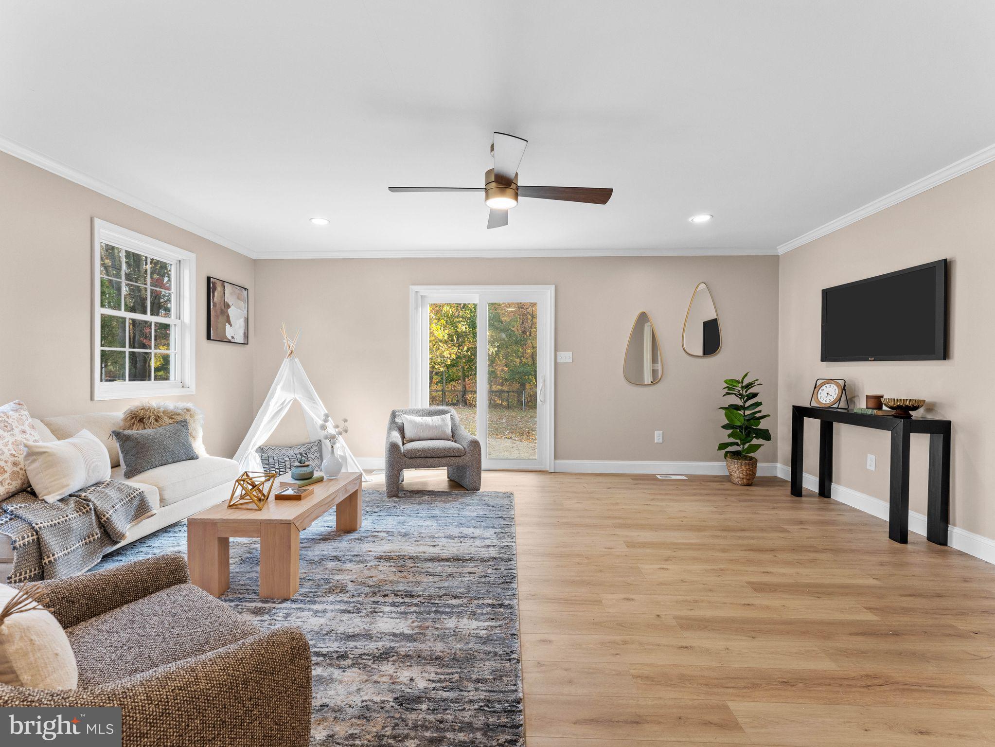 800 Bentley Road Lindenwold, NJ 08021 - Photo 10 of 32 a living room with furniture a window and a flat screen tv