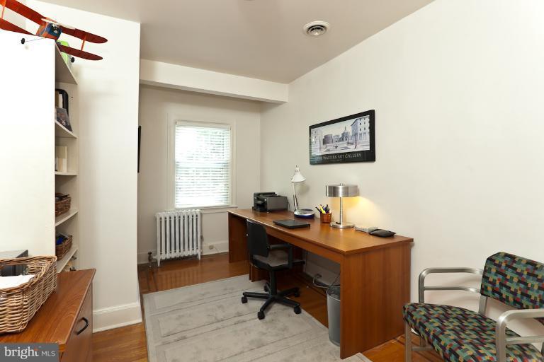 4229 Wickford Road Baltimore, MD 21210 - Photo 1 of 30 a view of a workspace with furniture and a window