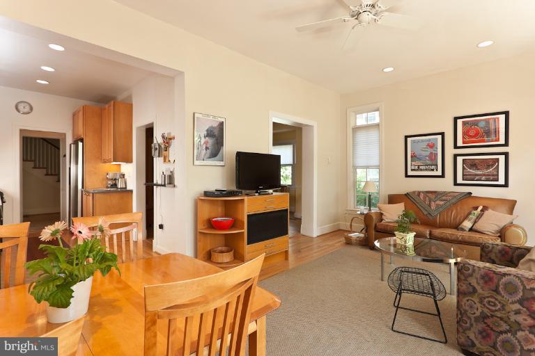 4229 Wickford Road Baltimore, MD 21210 - Photo 2 of 30 a living room with furniture and a flat screen tv