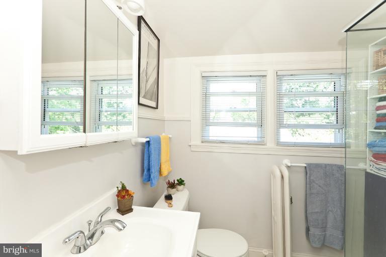 4229 Wickford Road Baltimore, MD 21210 - Photo 21 of 30 a bathroom with a sink and a window