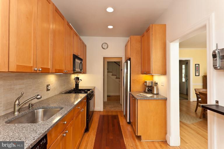 4229 Wickford Road Baltimore, MD 21210 - Photo 25 of 30 a kitchen with stainless steel appliances a sink stove and refrigerator