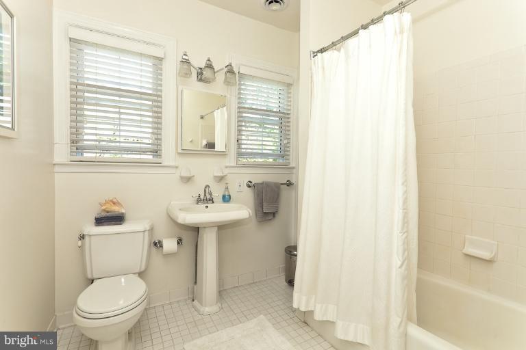 4229 Wickford Road Baltimore, MD 21210 - Photo 27 of 30 a bathroom with a sink a toilet and a bathtub