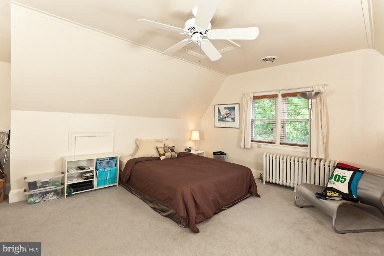 4229 Wickford Road Baltimore, MD 21210 - Photo 4 of 30 a bed room with a bed and a chair