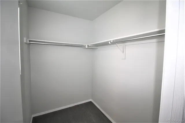 a view of an empty walk in closet