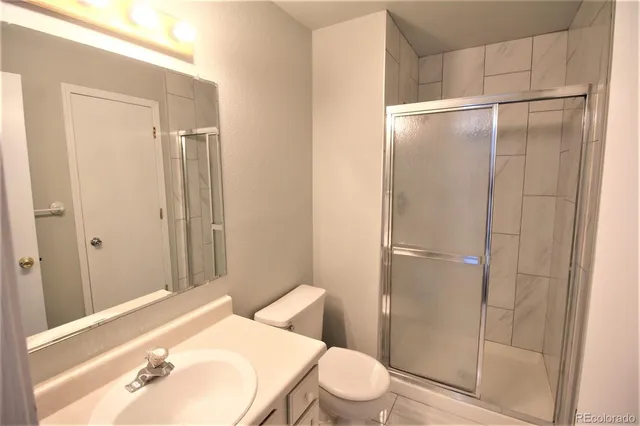 a bathroom with a sink and toilet