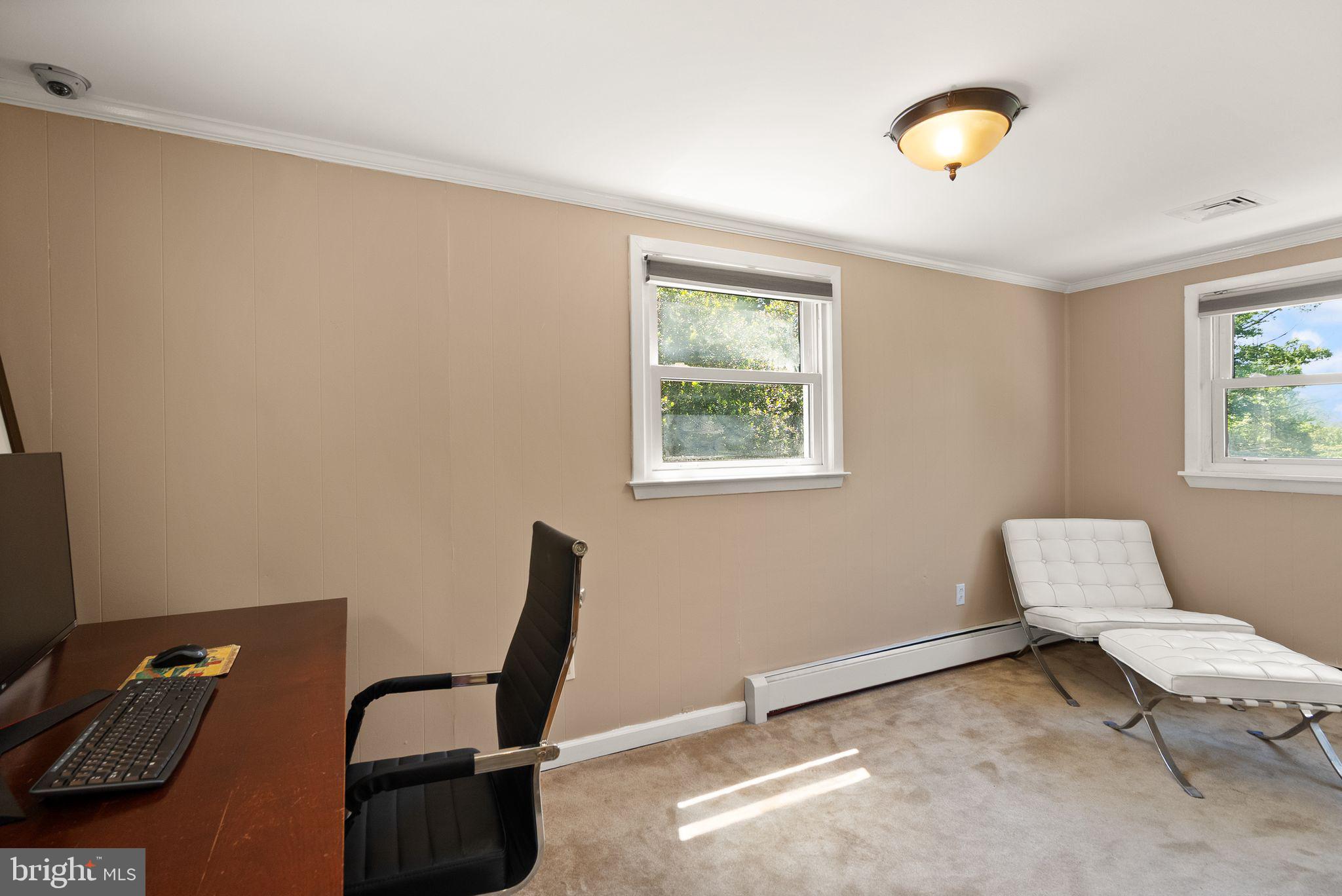 815 Seneca Road Great Falls, VA 22066 - Photo 34 of 61 a living room with furniture and a window