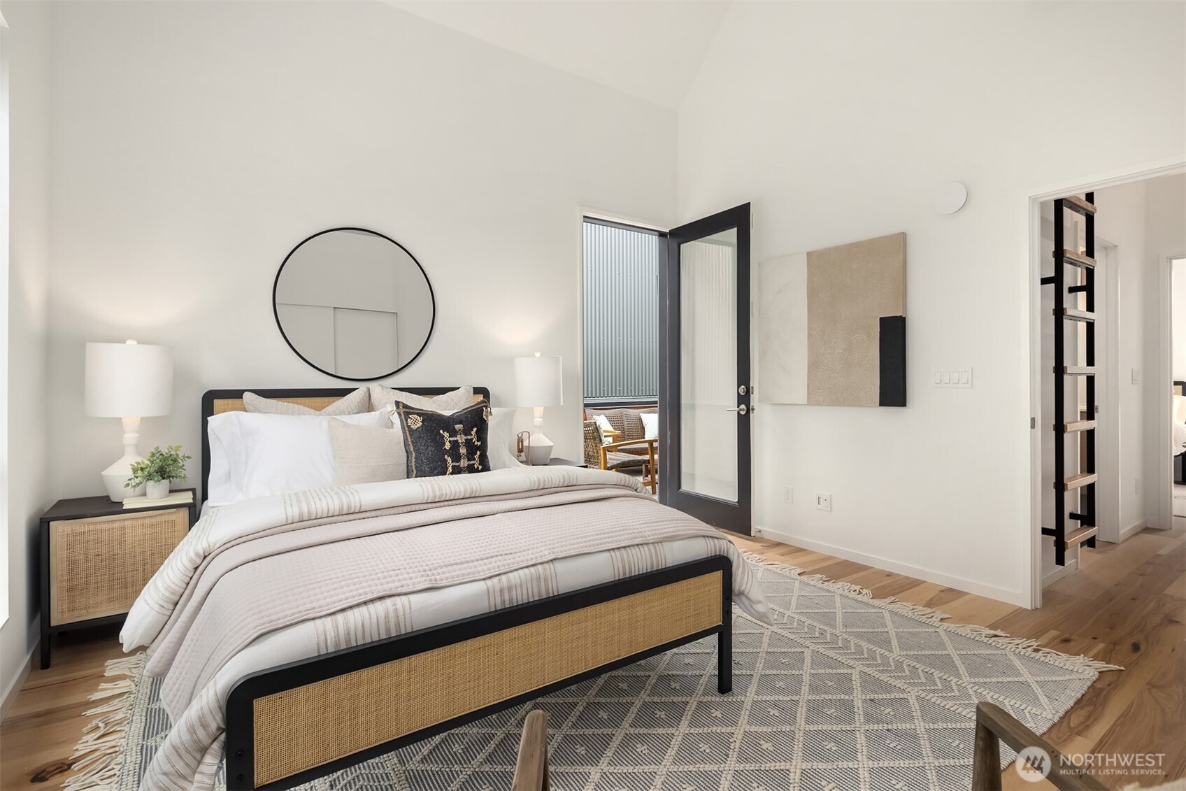 200 Shepard Way Northwest Bainbridge Island, WA 98110 - Photo 14 of 28 a bedroom with a bed and a painting on the wall