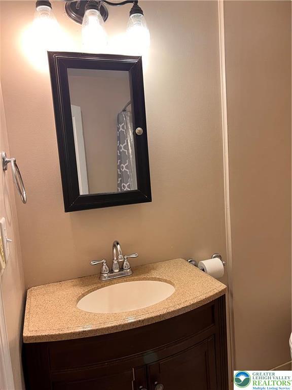 402 Prospect Avenue, Unit E2 Bethlehem, PA 18018 - Photo 6 of 11 a bathroom with a sink and a mirror