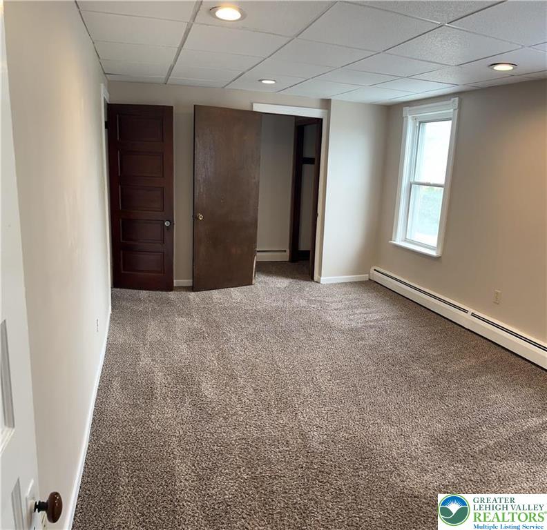 402 Prospect Avenue, Unit E2 Bethlehem, PA 18018 - Photo 8 of 11 an empty room with windows