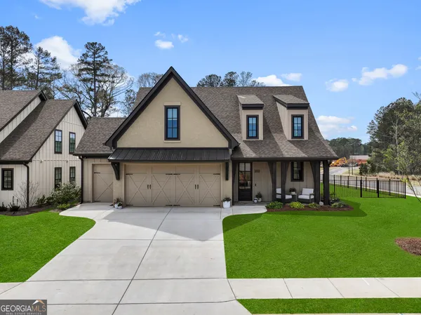 a view of a house with a yard porch and sitting area