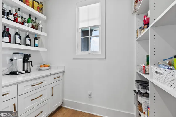 a view of cabinets and window