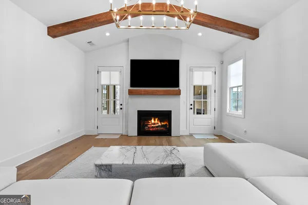 wooden floor with a fireplace in a room