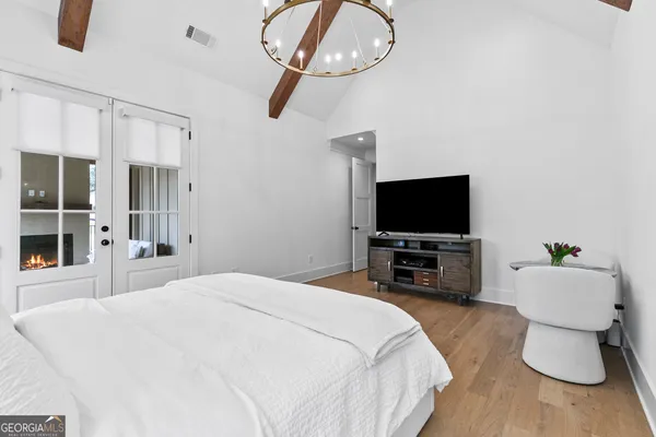 a kitchen with white cabinets and a sink