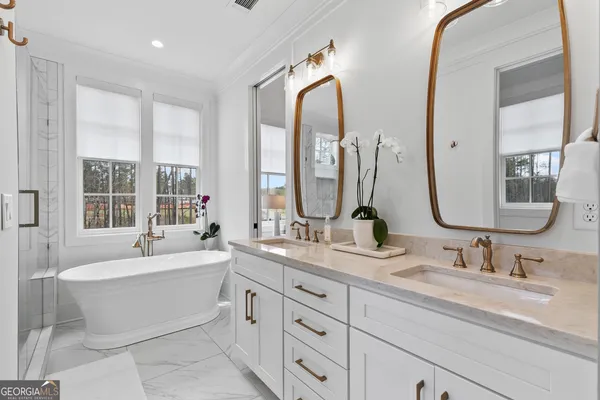 an empty room with a wooden floor and windows