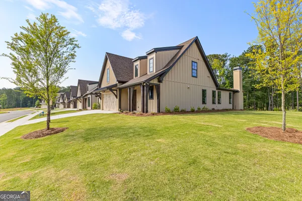a house view with swimming pool in front of it