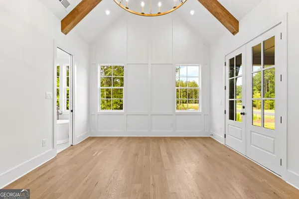a bathroom with a granite countertop sink and large window