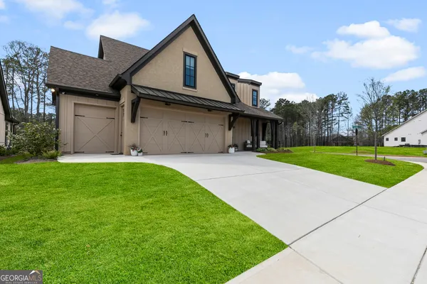 a front view of a house with garden