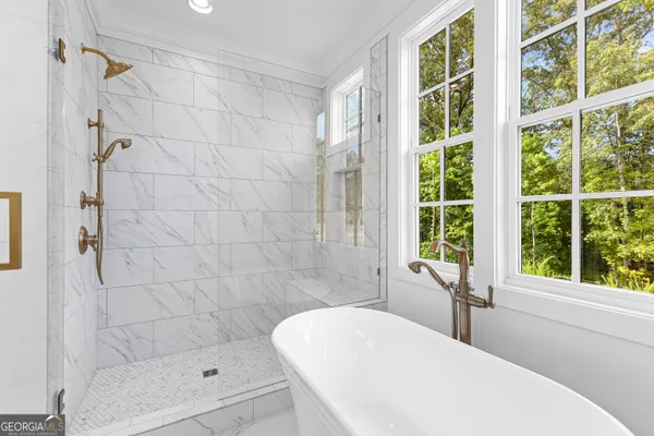 a bathroom with a sink a toilet and a bathtub