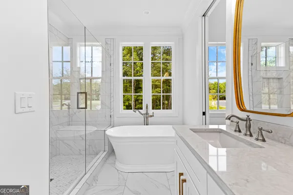 a view of a hallway with wooden floor and stairs