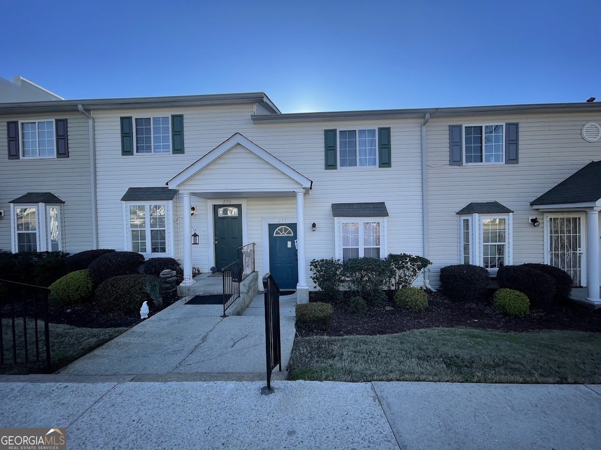 1625 Conley Road, Unit 277 Conley, GA 30288 - Photo 2 of 2 a front view of a house with garden