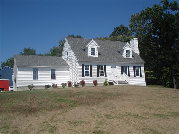 Lot 60 Hemlock West Roxbury, MA 02132 - Photo 1 of 9 a front view of a house with a yard
