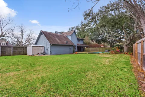 a view of a house with a back yard