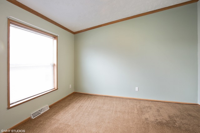137 Melbrooke Road Elgin, IL 60123 - Photo 9 of 17 an empty room with a window