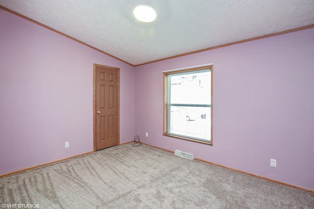 137 Melbrooke Road Elgin, IL 60123 - Photo 10 of 17 an empty room with a window