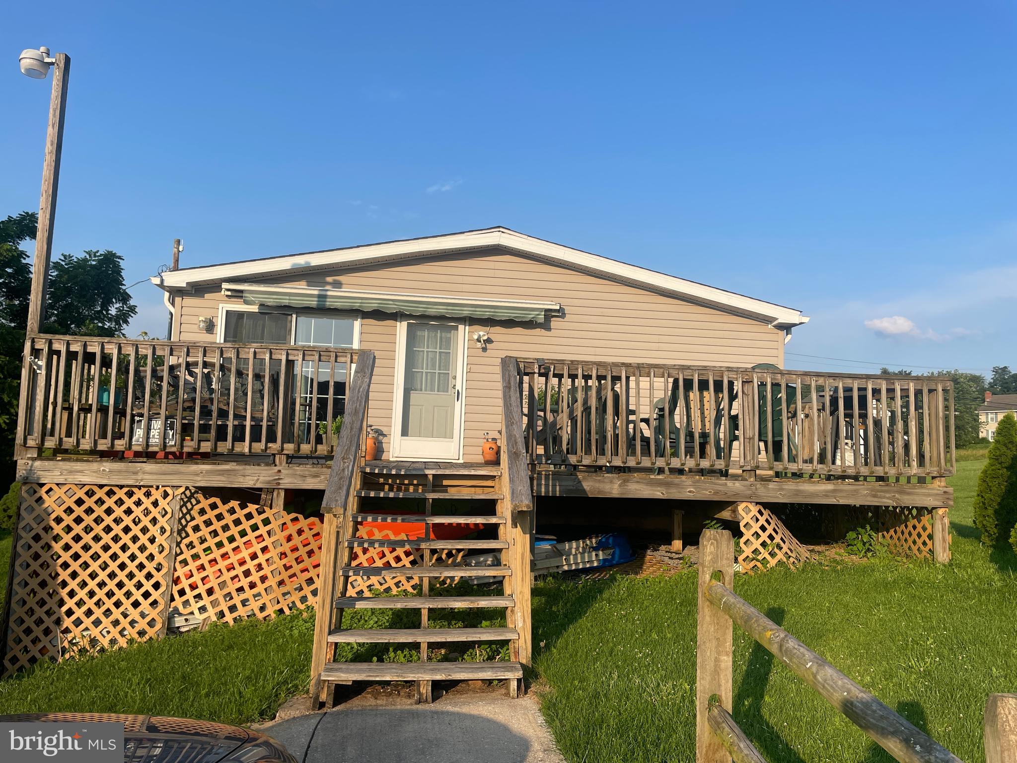 106 Bell Road Palmyra, PA 17078 - Photo 3 of 26 large side deck to kitchen with sliding door