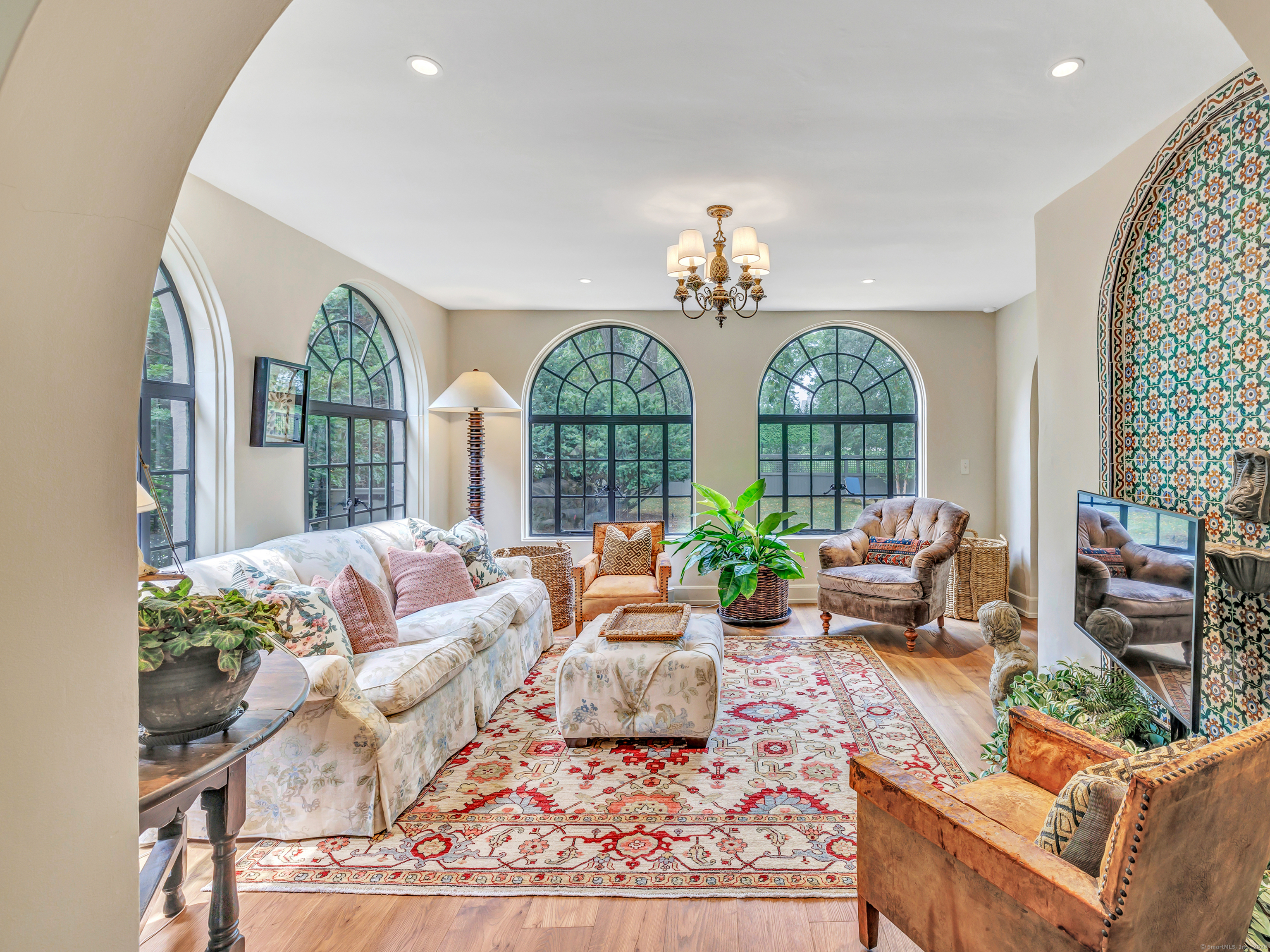 61 Clapboard Hill Road Westport, CT 06880 - Photo 22 of 40 The sunroom draws you in with glorious light and timeless elegance.
