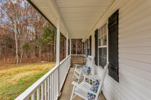 a view of balcony with furniture