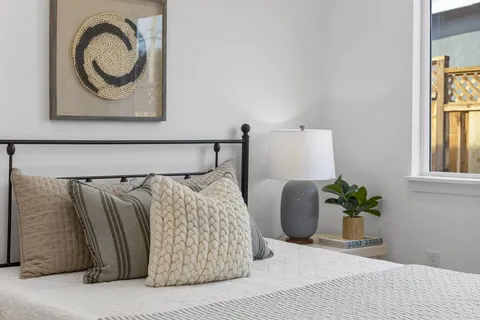 a bedroom with a bed and window