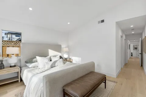 a bedroom with a bed and a couch