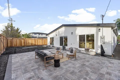 a outdoor space with patio furniture and potted plants
