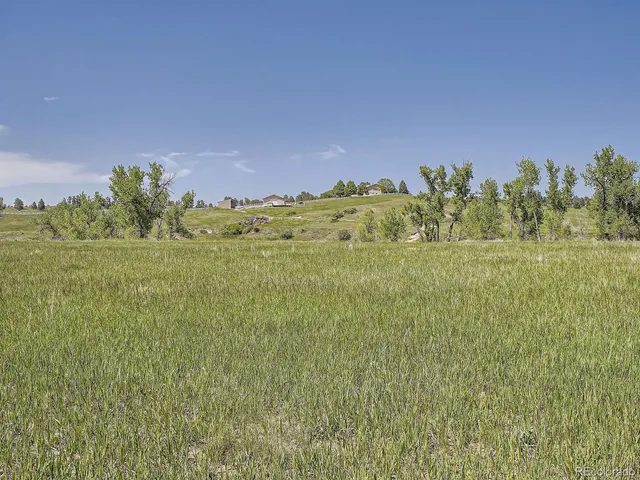 a kitchen with a sink appliances cabinets and furniture