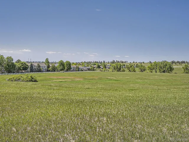 a kitchen with sink refrigerator and window