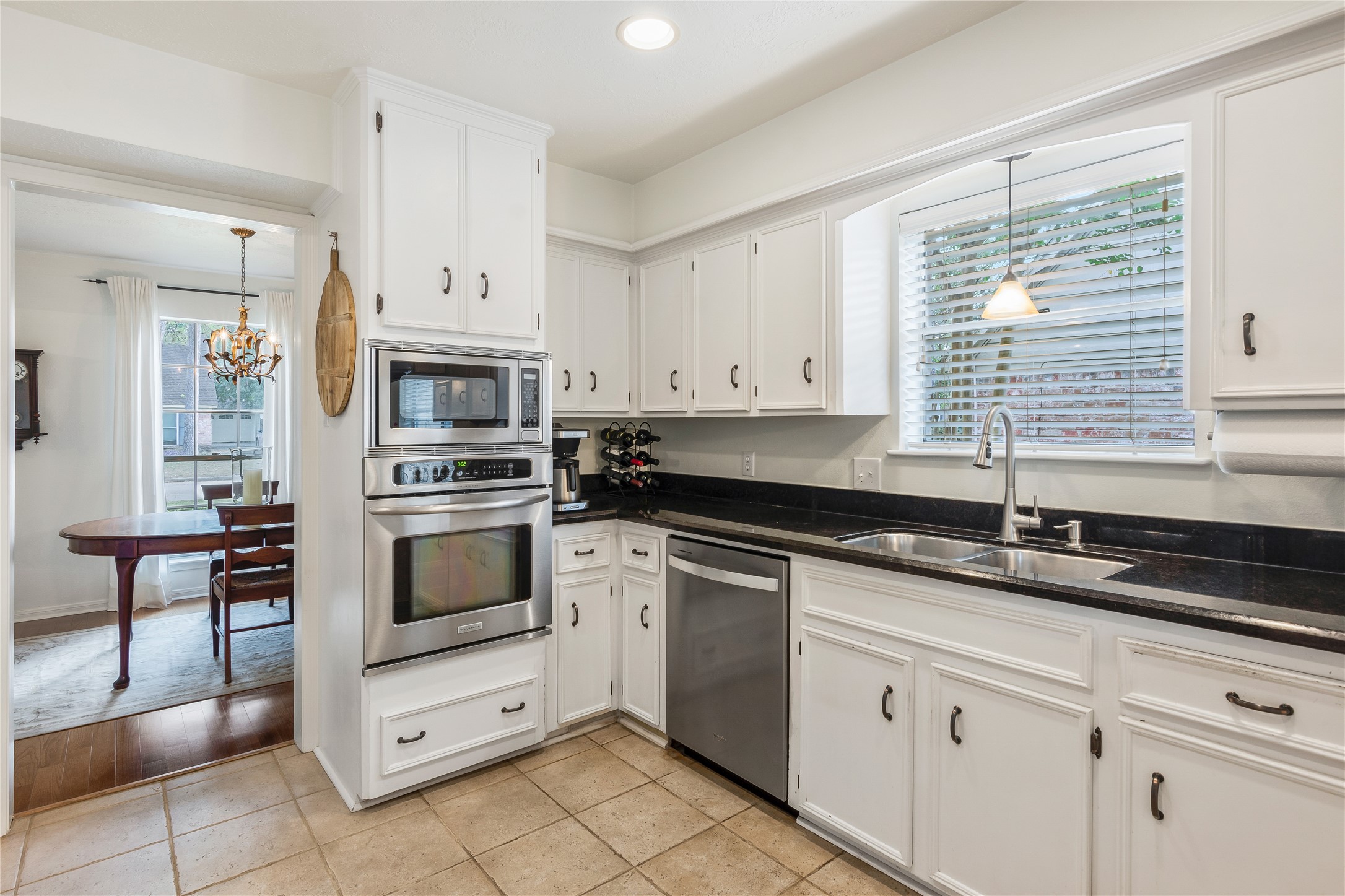 7622 Feliciana Lane Spring, TX 77379 - Photo 14 of 34 a kitchen with cabinets appliances a sink and a window