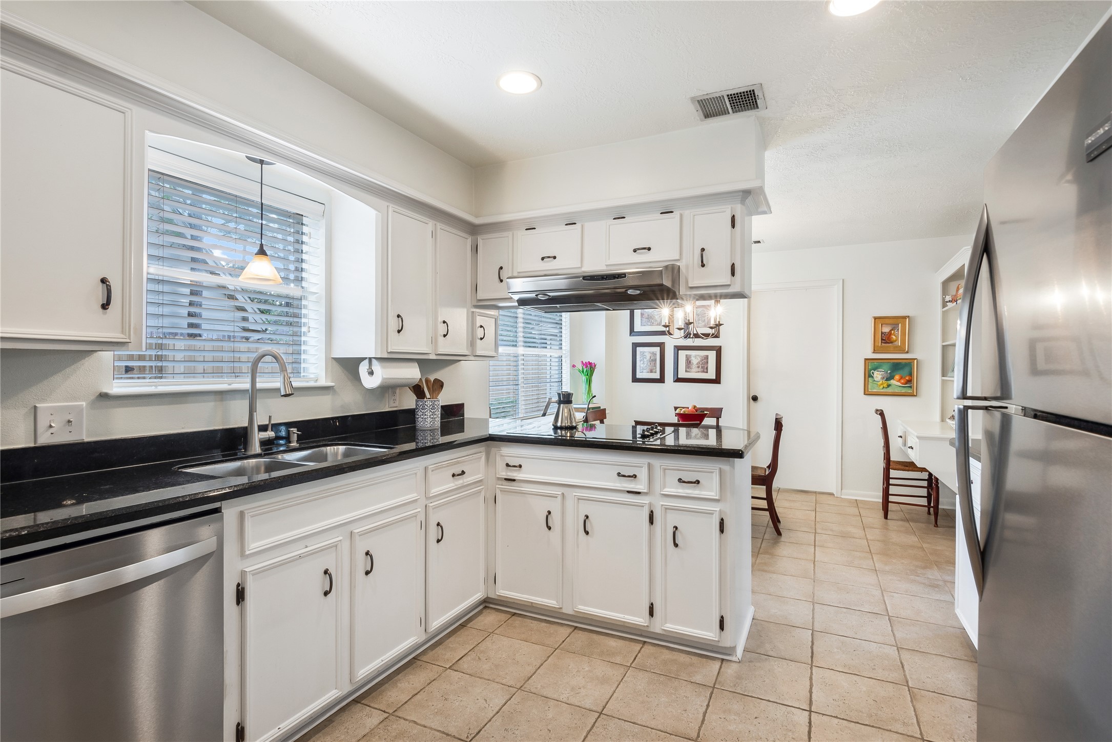 7622 Feliciana Lane Spring, TX 77379 - Photo 15 of 34 a kitchen with a sink window and cabinets